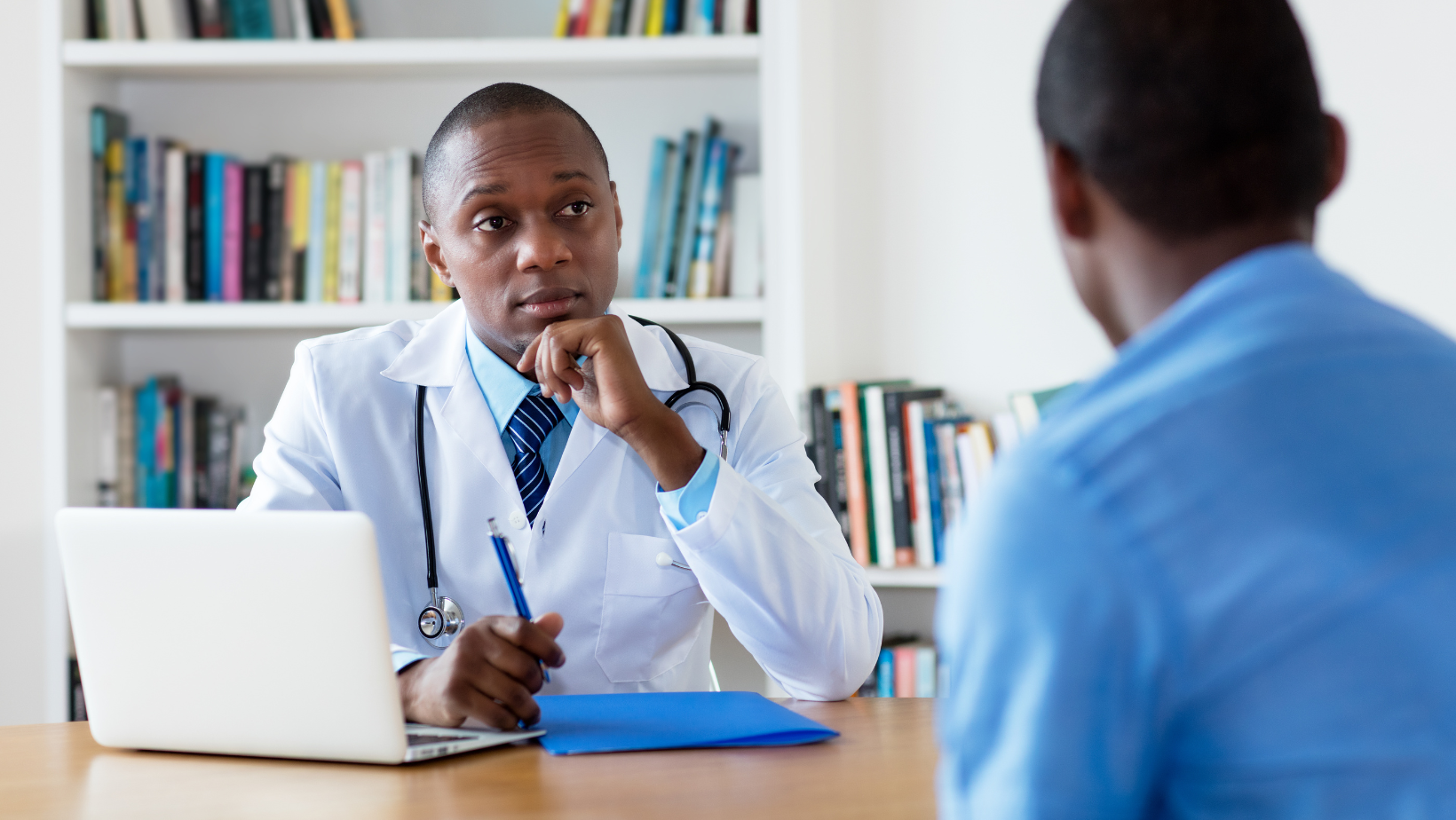 Doctor listening to patient