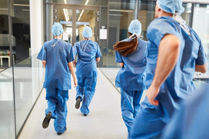 Healthcare workers running to an emergency 