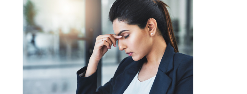Stressed woman sitting at work