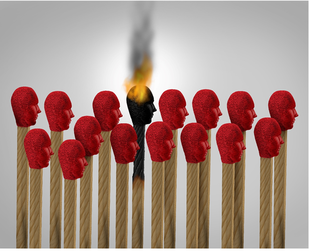 Book of matches that look like faces, one is on fire.