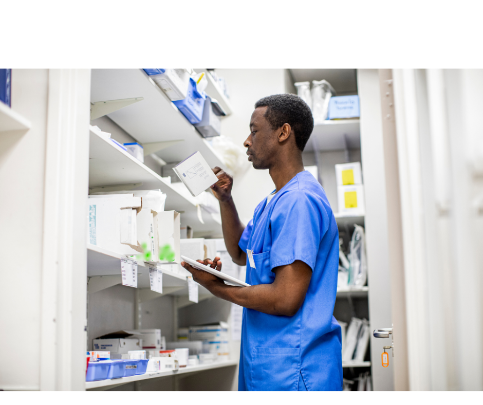 Man in supplies closet checking inventory