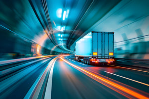Blurry lights as truck drives in tunnel