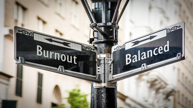 Signs pointing 2 directions: Burnout and Balance