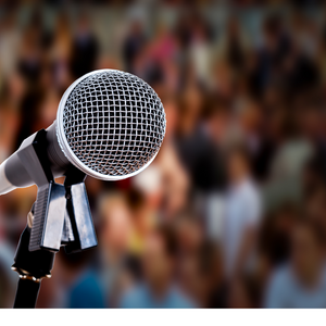 microphone and audience in background