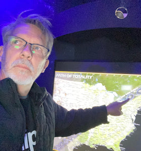 Jim Porter pointing to a map of the totality eclipse zone