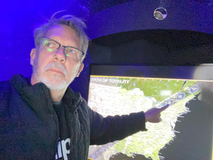 Jim Porter pointing to a map of the totality eclipse zone