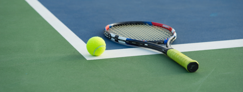 tennis racquet lying on court 