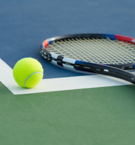 tennis racquet lying on court 