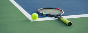 tennis racquet lying on court