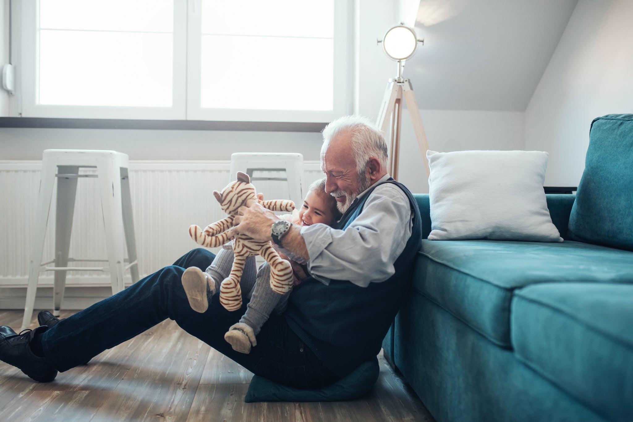 Grandpa playing with toddler