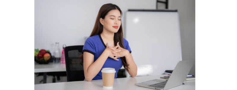 woman relaxing at desk